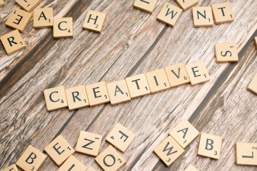 Scrabble tiles spelling out the word creative, illustrating creative intention in image making
